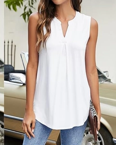 Macro view of white V-neck sleeveless blouse fabric and pleated chest detail