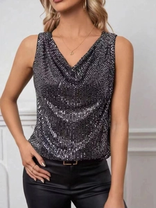 Detail view of shimmering black sequins on a fashionable cowl neck sleeveless top for women