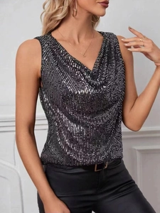 Detail view of sparkly silver sequins on black V-neck sleeveless cowl neck party top
