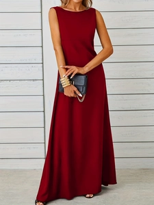 Detail view of the high-waisted seam and pleated hem on a wine red maxi dress
