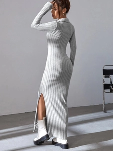 Detail view of the ribbed knit texture and side slit on this gray long sleeve dress