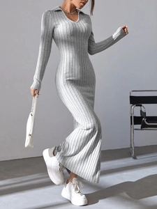 Detail view of the ribbed knit fabric texture and elegant collar on a grey maxi dress