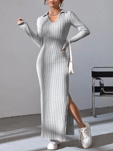 Detail of grey ribbed knit maxi dress featuring a high side slit and soft fabric texture