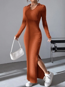 Detail of orange ribbed knit maxi dress featuring a V-neck collar and high side slit