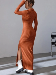 Detail view of orange long sleeve ribbed knit dress with lapel collar and side slit