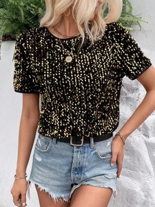 Detailed view of women's short sleeve top with shimmering gold sequins and round neck