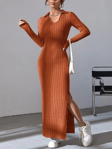 Detail view of the ribbed knit texture and side slit on this orange long sleeve dress