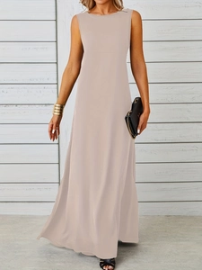 Detail of elegant sleeveless maxi dress in apricot with smooth flowy fabric texture
