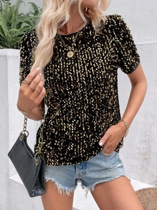 Detail of shimmering gold sequins on women's casual black short-sleeved t-shirt
