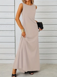 Detail of elegant beige sleeveless maxi dress showing smooth fabric and waist cut-line