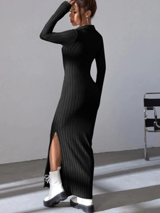 Close-up of elegant black ribbed knit dress featuring a polo collar and high side slit