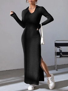 Detail of elegant black ribbed knit maxi dress featuring a chic side slit and polo collar