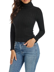 Close-up of black ribbed knit texture on a slim fit turtleneck long sleeve top