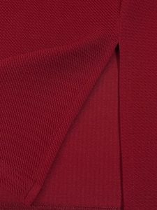 Detail view of the fine twill texture and neat stitching on a burgundy elegant dress