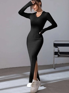Elegant black ribbed knit dress detail featuring long sleeves, V-neck lapel and side slit