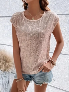 Dettaglio del top con paillettes oro rosa con trama luccicante per feste ed eventi