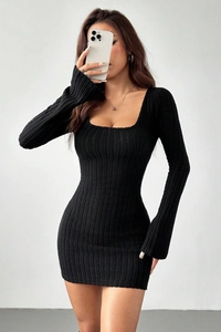 Close-up of black ribbed knit long sleeve dress with slim fit and square neckline design