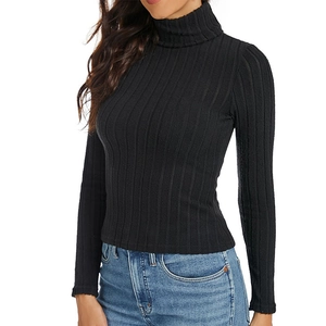 Slim fit black turtleneck ribbed long sleeve sweater for women paired with blue denim