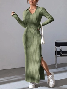 Detail of soft grass green ribbed knit dress with lapel V-neck and elegant side slit