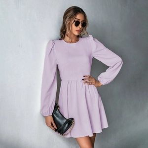 Detail of lavender A-line dress featuring puff sleeves and cinched waist design