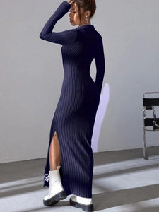 Detail of high side slit on elegant navy long sleeve ribbed knit midi dress