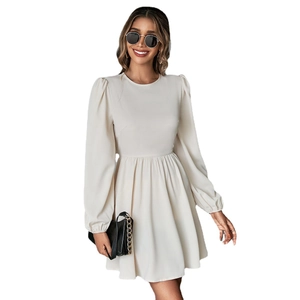 Elegant apricot puff sleeve dress with a high waist A-line silhouette and open back detail