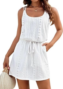 Detail of white eyelet embroidery and drawstring waist on a summer beach cover-up dress