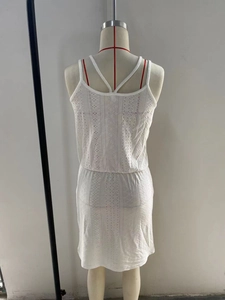 Detailed back view of white crochet swim cover-up dress with crisscross straps and elastic waist