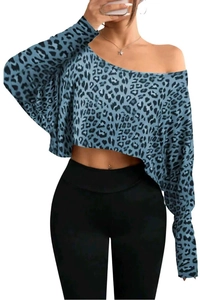 Detail of blue leopard print crop top featuring a chic one-shoulder neckline and long sleeves