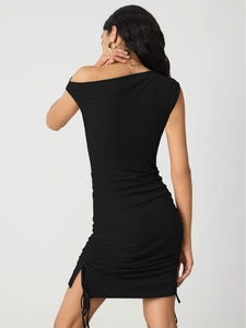 Rear view showing the drawstring side ruched detail on this black knit mini dress