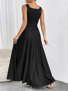 Detail view of women's sleeveless maxi dress showing elegant back cut and flowy black fabric