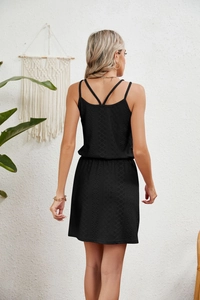 Detailed back view of black hollow-out beach cover up with criss-cross straps