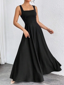Detailed view of the square neckline and wide shoulder straps on a black maxi dress