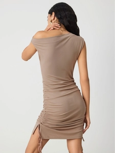 Close-up of khaki knit mini dress with adjustable side drawstring and ribbed texture