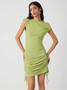 Detail view of lime green knitted mini dress with side ruching and drawstring accents