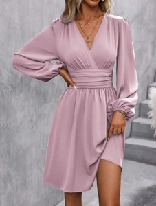 Detail of elegant dusty pink V-neck dress with pleated bust and cinched waistline