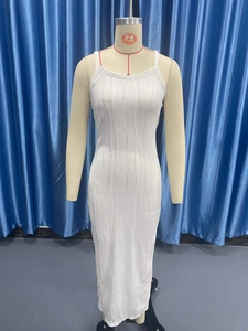 Detail of white sleeveless maxi dress featuring vertical ribbed pleated texture fabric