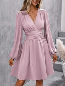 Detail of the elegant V-neckline and ruched waist on this lavender long sleeve dress