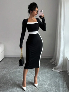 Elegant black and white contrast midi dress with square neck and visual slimming panels