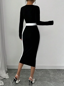 Slim fit long sleeve midi dress in black and white color block contrast design