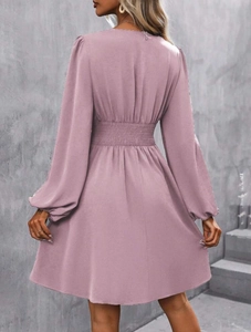 Detailed view of elastic high waist and lantern sleeve on mauve pink maxi dress