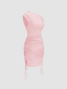 Detail view of the ruched side seams and ribbed knit fabric on a pink bodycon mini dress