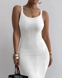Detail of white sleeveless ribbed maxi dress featuring vertical textured fabric and slim fit