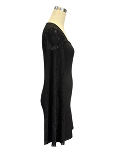 Detail view of black bodycon dress with sheer lace flare sleeves and square neckline