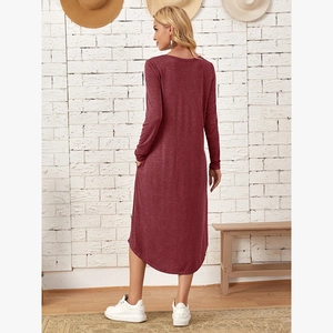 Detailed back view of a loose knit burgundy dress with side pockets and curved hemline