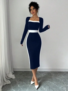 Slim fit long sleeve dress with black and white color block and deep U-neckline