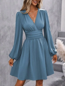 Detail of blue-grey V-neck dress with cinched waist and lantern sleeve design