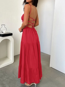 Close-up of red backless halter maxi dress with crisscross tie details and tiered skirt