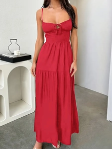 Detail showing the pleated neckline and tie-knot on the red backless tiered maxi dress