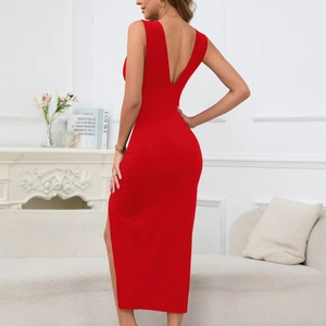 Detail view of the deep V-neck backless design on this slim red dress with side slit